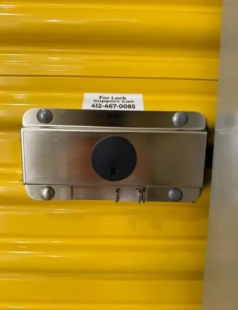 Yellow storage unit door with wireless lock system